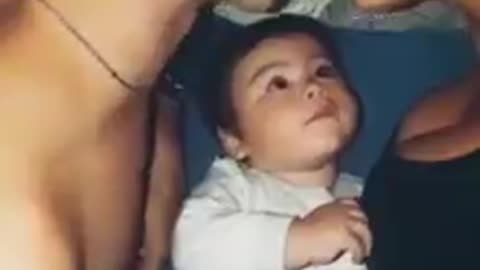 Cute baby reaction to his father and mother love