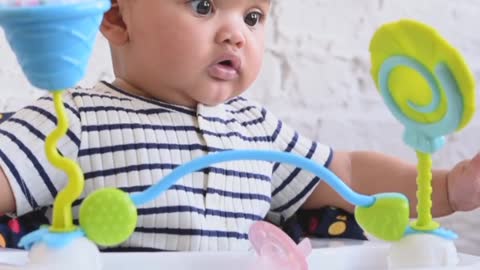 Baby plaing with toys,playing with rings,