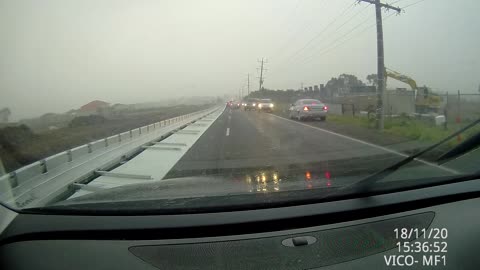 Roadwork Barriers Blow Down onto Road