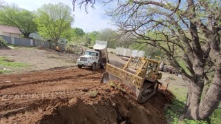 Bulldozer action with a little dump truck