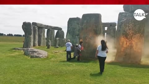 Anti-oil activists douse Stonehenge with orange paint ahead of summer solstice