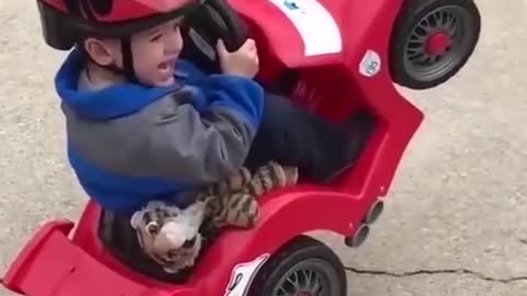 KID RIDING TOY CAR GETS INTO TROUBLE