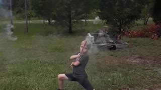 Kid with Roman Candle Takes Out Camera