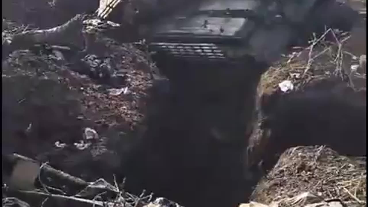 A Ukrainian T-64 tank that got stuck in a trench while trying to attack Russian positions.