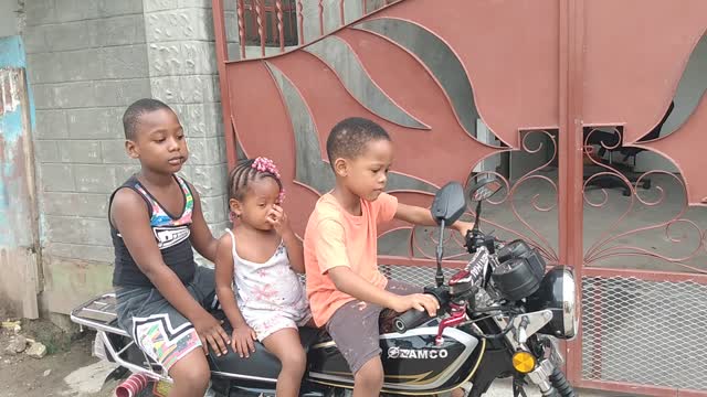 Five year old boy ride bike in Jamaica