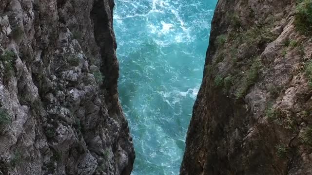 an intimidating view from the gorge over the water and rocks