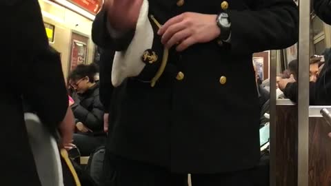Army guys hold up different numbers to each other on subway