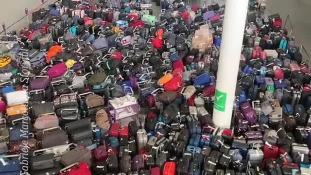 A sea of luggage piled up at Heathrow Airport due to a tech malfunction