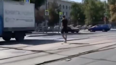 Man walking between car