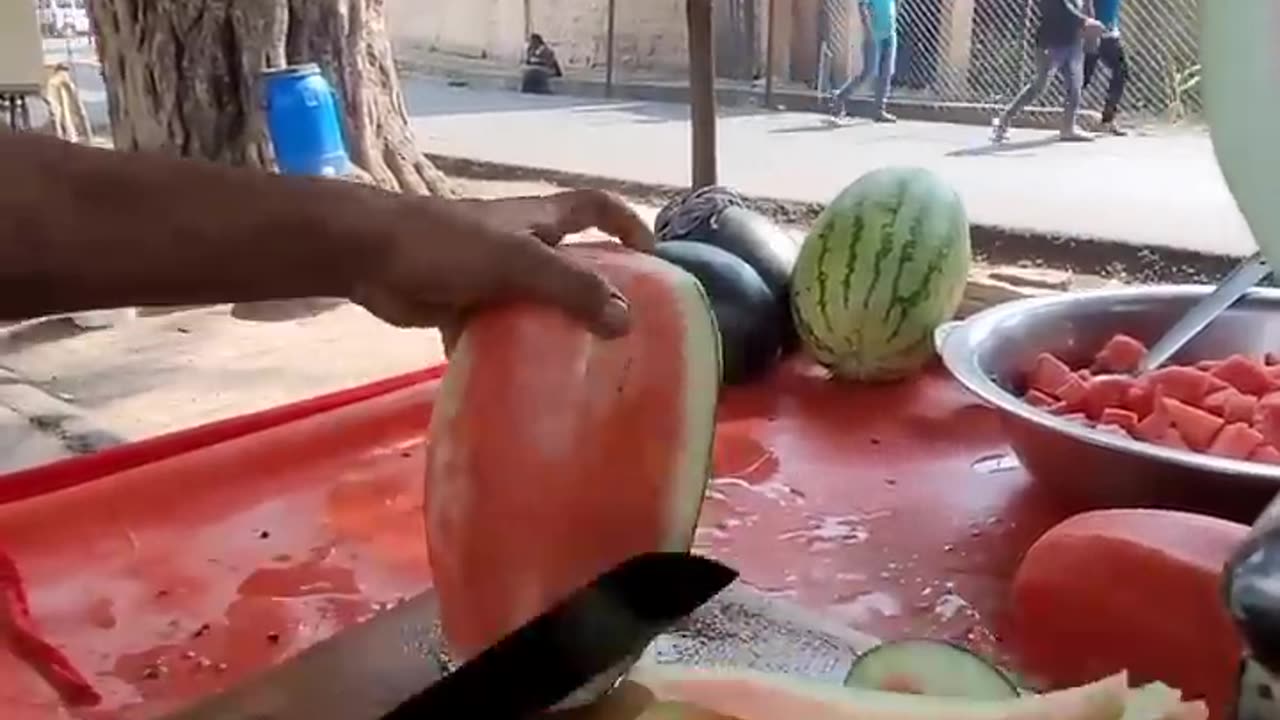 Amazing watermelon cutting on the street