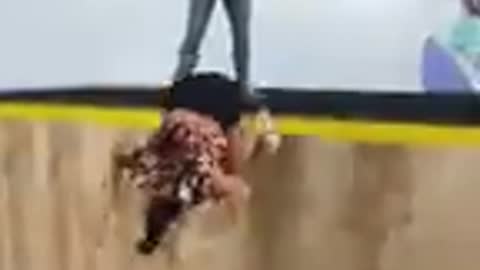 Girl Falls to the Ground Trying a Pull Over on a Trampwall