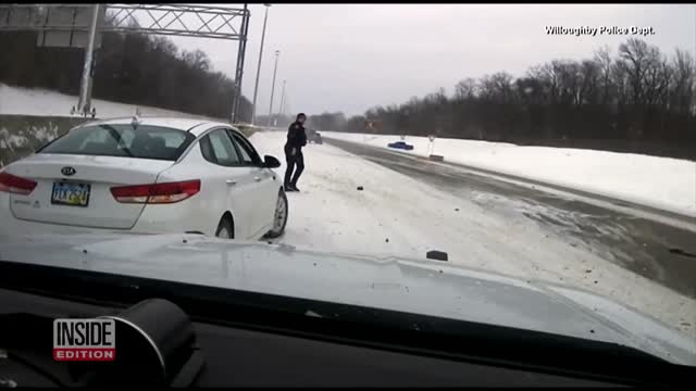 Police Officer Runs to Avoid Out-of-Control Car on Highway