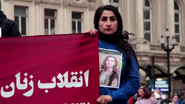 Activists shave heads at London rally for women's rights in Iran