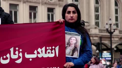 Activists shave heads at London rally for women's rights in Iran