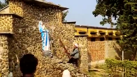 Man Takes Out his Anger on a Statue of Our Lady