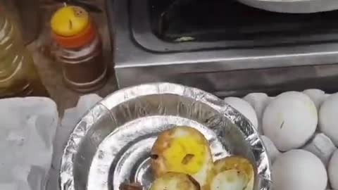 Person Stir-Fries Hard-Boiled Egg With Spices