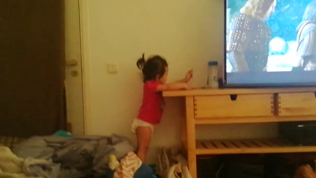 Baby girl breaking headphones