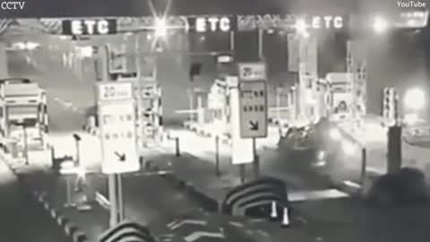 Car slams into a motorway toll station sending vehicle flying 50ft into the air