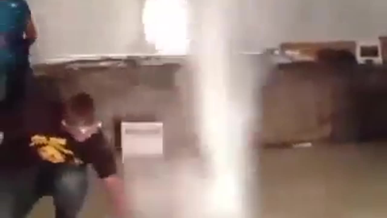 Two people with minimum materials create an indoor tornado.