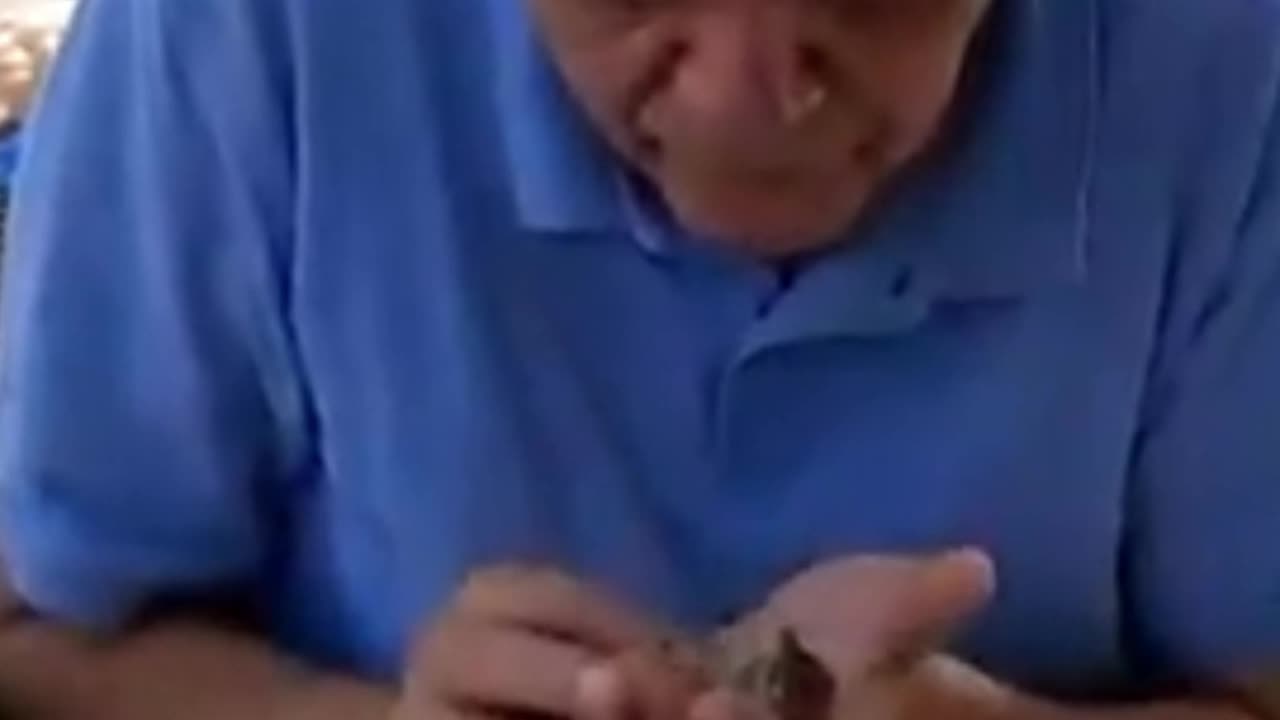 Guy does CPR on bird