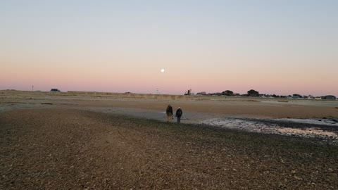 Full moon at a sunset