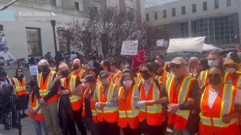 Columbia University faculty link arms and form a wall