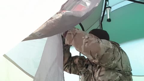 Opening the tent