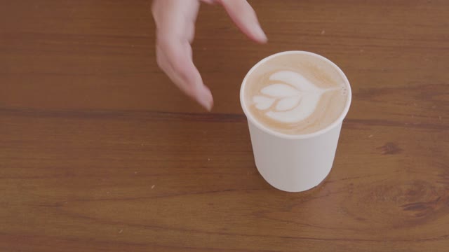 A Barista Making A Coffee Artistically .