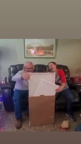 Dad & Allyson open their gift