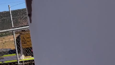 Giant Orb hanging from the solar panel frame