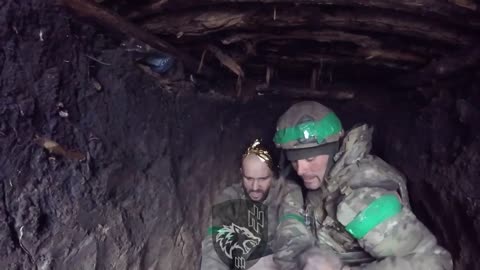 Ukrainian Medic Examines a Wounded Soldier