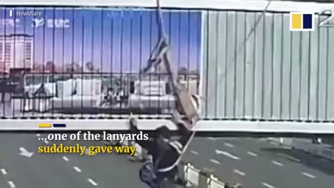 Bus catches worker dangling from