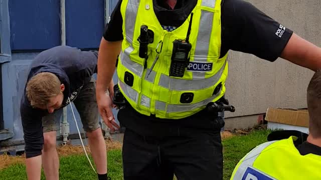 Police in Scotland Enjoy a Slip and Slide