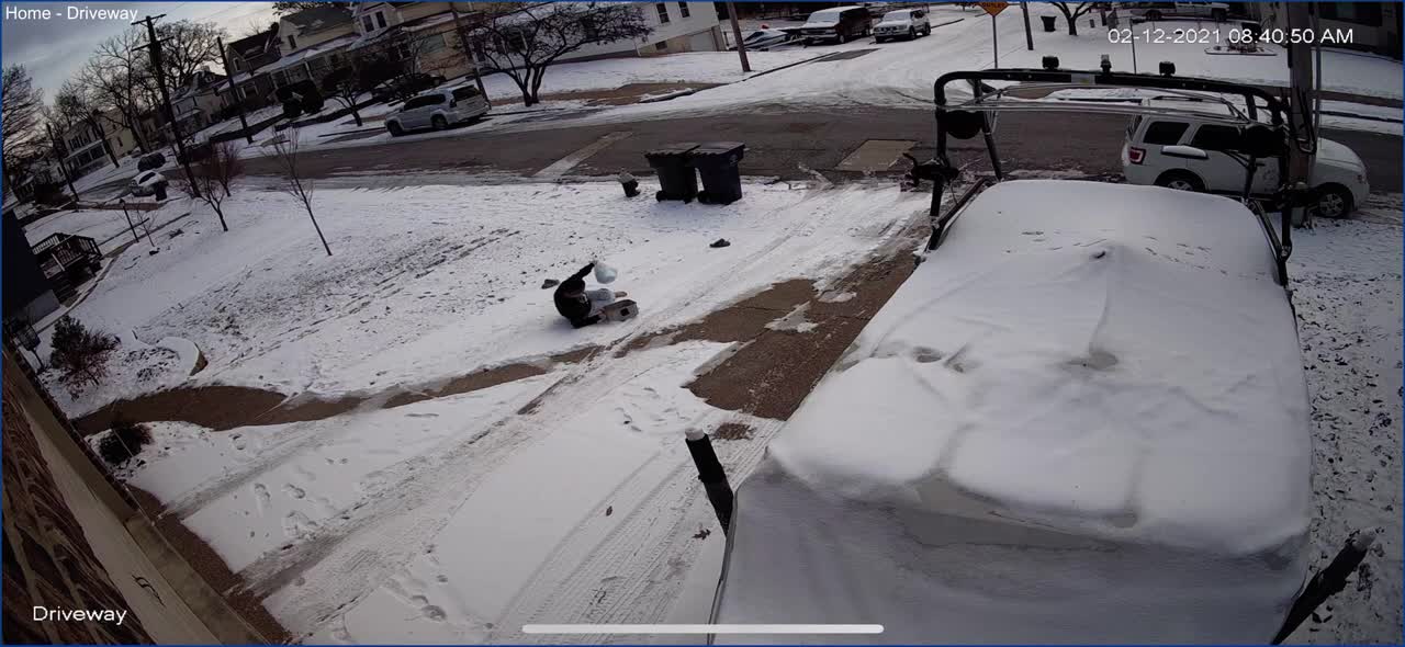 Woman Slides And Falls, Walking On Snow In The Driveway