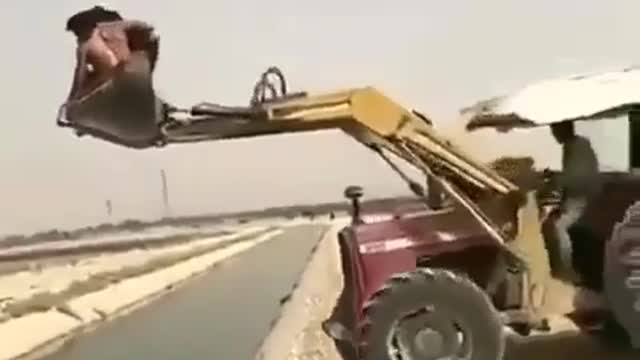 Crossing the river on a forklift