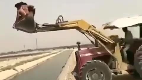 Crossing the river on a forklift