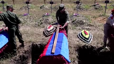 Pro-Russian separatists in Luhansk bury soldiers