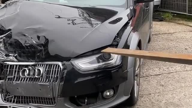 The hood of the car is stuck and can't be opened. Try using a forklift.