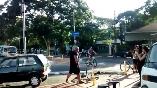 Buff Biker Lifts Car Off of Bike Path | Funny Videos