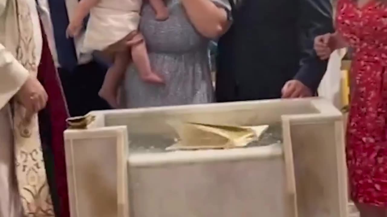 11-month-old baby boy found a way to sprinkle some comedy into his baptism.