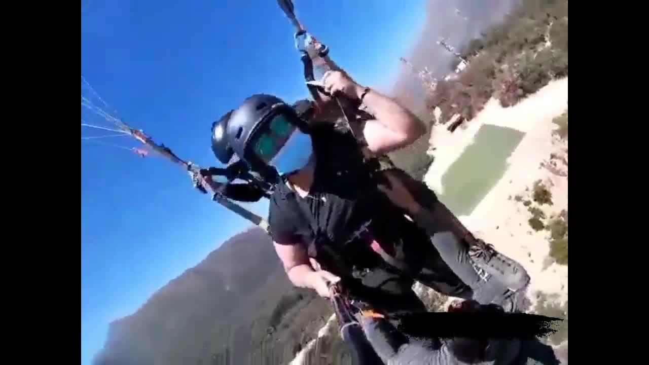 Man Is Left Dangling By His Hands From A Paraglider!