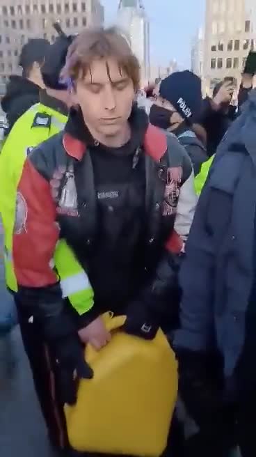 Ottawa police -- jerry can arrest. "LET HIM GO! LET HIM GO!"