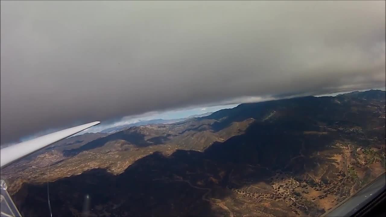 Glider pilot flying in Warner springs CA under clouds.