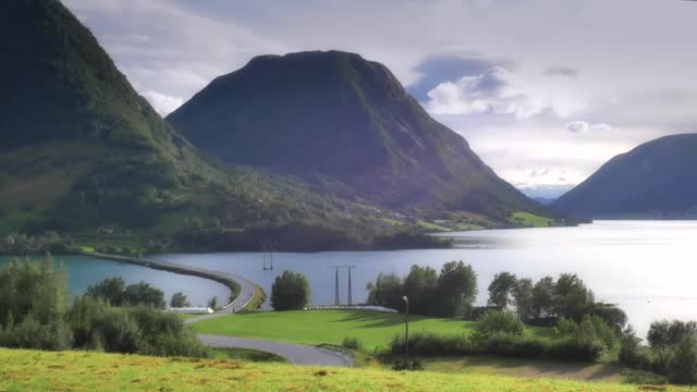 beautiful scenic view of norway road crossing fjord