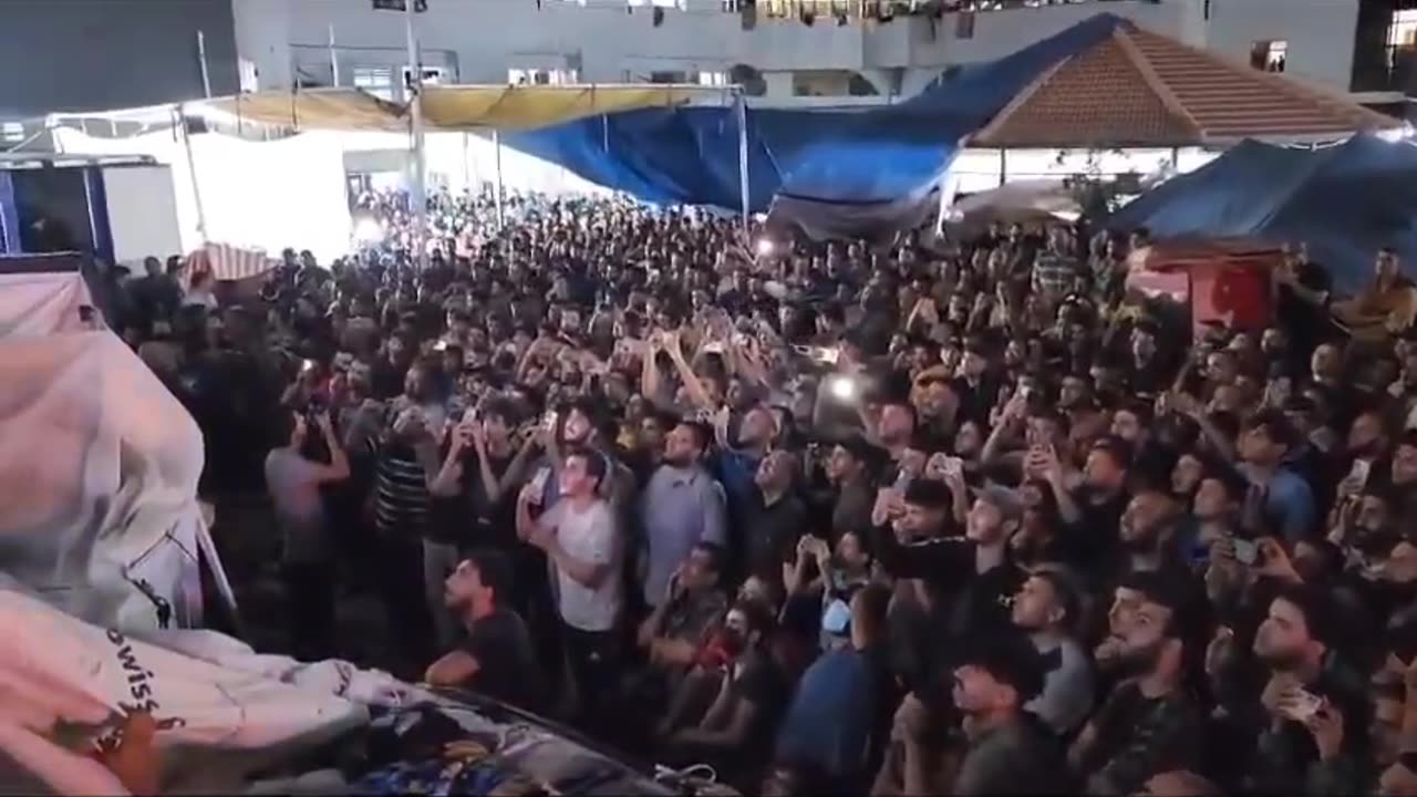 Men In Gaza Celebrate Hamas Attacks On The Big Screen At Al-Shifa Hospital