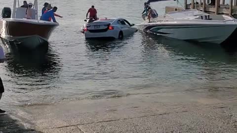 Car Drives into Water at Boat Ramp Almost Sinking Car