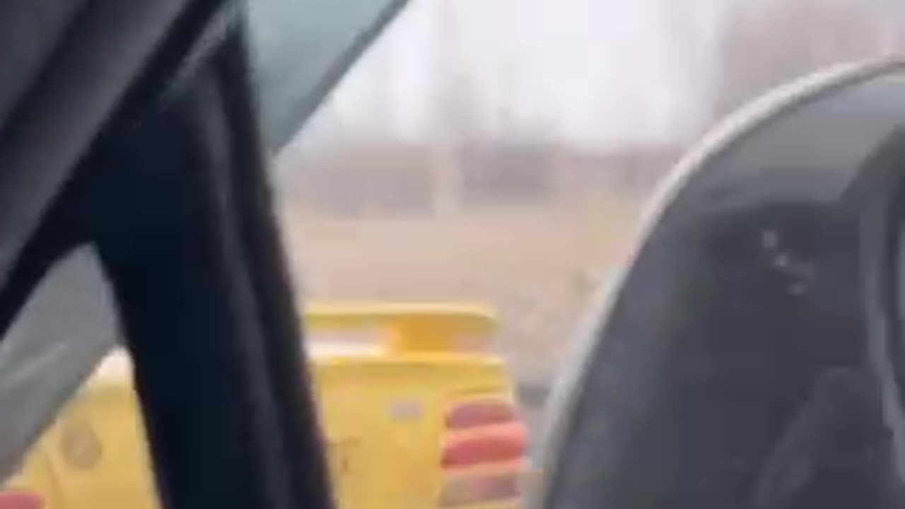 Convertible With Its Top Down in a Freezing Rain Storm