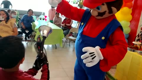 Houston mascot party character Mario plays the ghost catcher game in Richmond Texas at a birthday