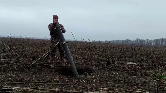 Ukrainian soldiers fire mortars, test new equipment