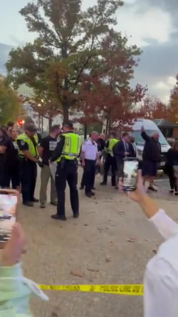 John Fetterman waves an Israeli flag at ceasefire protesters